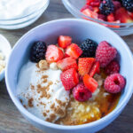 Berry and Syrup Porridge with ingredient in the background