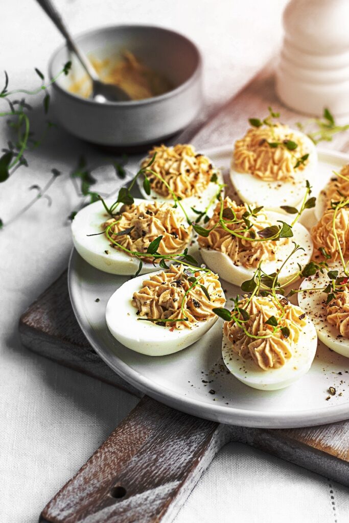 A image of Deviled eggs on a white plate