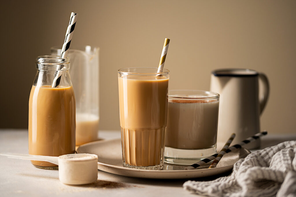 Glasses of protein chocolate drinks, milkshake or coffee refreshing drink