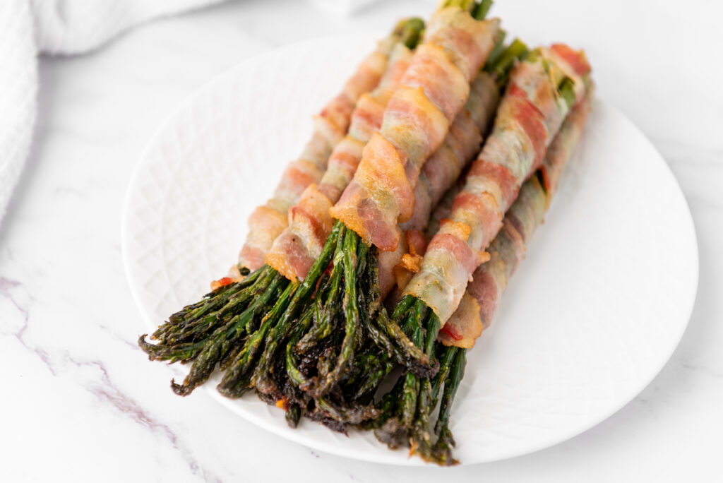 Bacon Wrapped Asparagus on a white plate